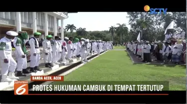 Unjuk rasa ormas Islam, ricuh, karena menolak kebijakan peraturan Gubernur Aceh tentang hukuman cambuk.