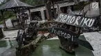 Sebuah bangkai motor yang terkena erupsi Gunung Merapi tahun 2010 di Galeri Sarsuadji, Sleman, Jawa Tengah, Minggu (26/11). Letusan dahsyat erupsi Gunung Merapi pada 2010 silam menewaskan sekitar 353 warga sekitar lereng. (Liputan6.com/Faizal Fanani)