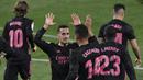 Pemain Real Madrid, Casemiro dan Lucas Vazquez, merayakan gol ke gawang Real Valladolid pada laga Liga Spanyol di Stadion Jose Zorrila, Minggu (21/2/2021). Real Madrid menang dengan skor 1-0. (AP/Alvaro Barrientos)