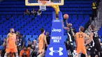 Petinju asal AS, Floyd Mayweather berusaha memasukan bola saat bertanding pada acara Monster Energy Outbreak Presents $50K Charity Challenge Celebrity Basketball Game di UCLA's Pauley Pavilion di Westwood, California (17/7). (AFP Photo/Vivien Killilea)