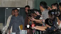 Ketua Badan Legislasi DPRD DKI Jakarta, M Taufik keluar dari Gedung KPK, Jakarta, Senin (11/4) Taufik diperiksa sebagai saksi atas tersangka M Sanusi dalam kasus dugaan suap pembahasan Raperda terkait reklamasi Teluk Jakarta. (Liputan6.com/Helmi Afandi)