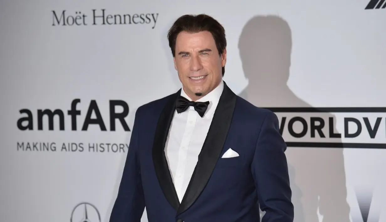 Selain diduga sebagai gay, aktor John Travolta juga pernah dituduh melakukan pelecehan seksual terhadap sesama pria. (AFP PHOTO/Alberto PIZZOLI)