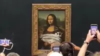 Lukisan Mona Lisa dirusak oleh aktivis lingkungan hidup menggunakan krim kue (Twitter.com/@lukeXC2002)