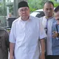 Gubernur Bengkulu Ridwan Mukti dikawal petugas KPK saat diamankan ke gedung KPK, Jakarta, Selasa (20/6). (Liputan6.com)