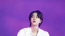 Penampilan Jin BTS dengan busana berwarna putih yang dipadukan merah ini juga tak lepas dari sorotan. Gaya kasual Jin BTS saat di atas panggung ini pun tetap terlihat memesona. (Liputan6.com/IG/@jin)