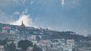 Biara kuno abad ke-17 di Tawang bertengger di puncak gunung tinggi ribuan kaki di atas permukaan laut dengan pemandangan lanskap sekitarnya dan kota Tawang di bawahnya.  Biara ini merupakan rumah bagi lebih dari ratusan biksu. (AFP/Arun Sankar) (AFP/Arun Sankar)