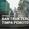 Ban Truk Terlepas Timpa Pemotor