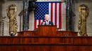 Presiden Joe Biden berpidato di Kongres, US Capitol, Washington, Amerika Serikat, Rabu (28/4/2021). Pembatasan tamu undangan untuk acara kali ini karena protokol kesehatan COVID-19 dan keamanan. (Melina Mara/The Washington Post via AP, Pool)
