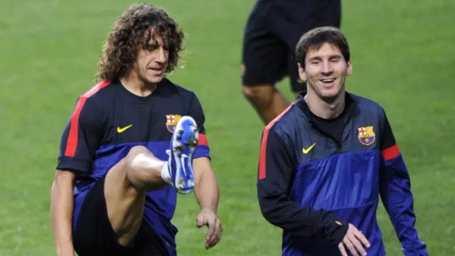 Carles Puyol dan Lionel Messi