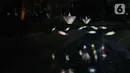 Suasana Jakarta Lights Festival di Taman Sumenep, Jakarta, Jumat (23/12/2022). Pemprov DKI Jakarta menggelar acara Jakarta Lights Festival sebagai rangkaian perayaan Natal dan Tahun Baru (Nataru) 2023. (Liputan6.com/Herman Zakharia)