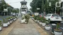 Suasana lalu lintas di Kawasan Kota Tua, Jakarta, Rabu (3/8/2022). Proyek revitalisasi jalur pedestrian di kawasan Kota Tua akan selesai pada Agustus 2022, yang sudah mencapai 98 persen. (Liputan6.com/Herman Zakharia)
