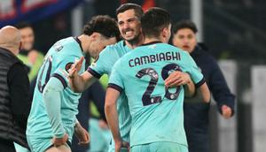 Bertanding di leg kedua 16 besar Liga Europa 2025/2026, Bologna unggul agregat 5-4 atas AS Roma. Tampak dalam foto, penyerang Bologna asal Italia, Nicolo Cambiaghi, merayakan golnya pada pertandingan leg kedua 16 besar Liga Europa 2025/2026 melawan AS Roma di Stadion Olimpico, Kamis (19/3/2026) waktu setempat atau Jumat 20 Maret 2026 dini hari WIB. (Alberto PIZZOLI/AFP)