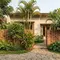 6 Inspirasi Fasad Rumah dengan Pagar Roster dan Tanaman Mini, Estetik, Sejuk dan Modern