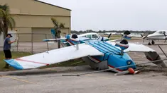 Sebuah pesawat terbang terbalik di Bandara Kota Venice setelah Badai Milton melewati area tersebut pada 11 Oktober 2024, di Venice, Florida. (Joe Raedle/Getty Images North America/Getty Images via AFP)