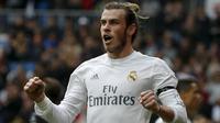 Selebrasi Gareth Bale saat mencetak gol bagi Real Madrid ke gawang Rayo Vallecano, Minggu (20/12/2015) malam WIB. Bale mencetak empat gol ke gawang Rayo Vallecano. (Reuters/Sergio Perez)