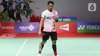 Pebulu tangkis tunggal putra Indonesia Jonatan Christie seusai melawan wakil Irlandia Nhat Nguyen pada babak 32 besar Indonesia Masters 2023 di Istora Senayan, Jakarta, Rabu (25/1/2023). Jojo, panggilan Jonatan Christie, selaku unggulan keempat dan ganda putra nomor tiga dunia tampak terlambat panas. (Liputan6.com/Herman Zakharia)