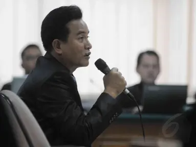 Pakar Hukum Tata Negara Yusril Izha Mahendra memberikan keterangan sebagai saksi di Pengadilan Tipikor, Rabu (3/9/14). (Liputan6.com/Herman Zakharia)