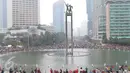 Suasana Car Free Day di kawasan Bundaran HI, Jakarta, Minggu (27/12/2015). Kemeriahan libur akhir tahun dimanfaatkan warga untuk menikmati lengangnya Jakarta. (Liputan6.com/Angga Yuniar)