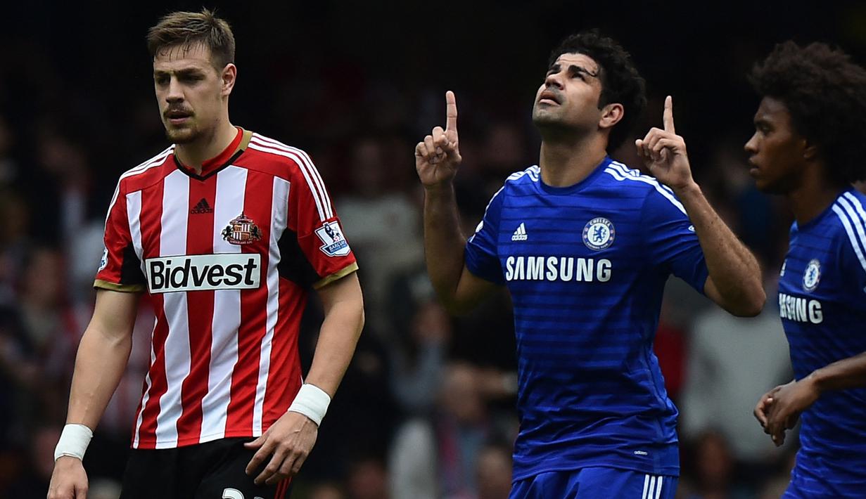 Diego Costa. Striker Spanyol berusia 34 tahun yang baru saja bergabung dengan Wolverhampton pada awal musim 2022/2023 ini juga mampu mencetak 20 gol di musim pertamanya di Liga Inggris dalam 26 laga bersama Chelsea setelah didatangkan dari Atletico Madrid pada awal musim 2014/2015. Gol ke-20 dicetak saat Chelsea menang 3-1 atas Sunderland pada pekan terakhir Liga Inggris 2014/2015 (24/5/2015). (AFP/Ben Stansall)