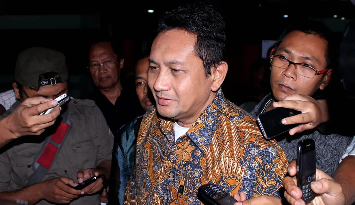 Setelah diperiksa penyidik Kejagung selama 10 jam, Udar Pristono diberangkatkan ke Rutan Salemba Cabang Kejaksaan Agung, Jakarta, (17/9/14). (Liputan6.com/Johan Tallo)