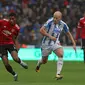 Gol Marcus Rashford (kiri) tak bisa selamatkan MU dari kekalahan (LINDSEY PARNABY / AFP)