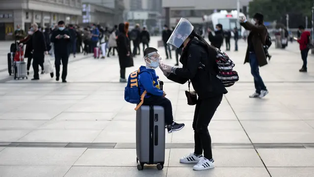 FOTO: Penampilan Berbeda Warga Wuhan Setelah Corona Mereda