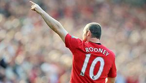 Aksi striker Manchester United, Wayne Rooney ketika berhadapan dengan Manchester City dalam lanjutan Liga Premier di Old Trafford, Manchester, 20 September 2009. AFP PHOTO/ANDREW YATES