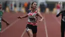 Atlet asal DKI Jakarta, Jeany Nurainy saat menyelesaikan lomba lari 100 meter putri U-20 Kejurnas Atletik U18, U20 dan Senior 2019 di Stadion Pakansari, Kab Bogor, Jumat (2/8/2019). Jeany Nurainy meraih posisi pertama dengan catatan waktu 12,15 detik. (Liputan6.com/Helmi Fithriansyah)