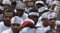 Massa berikat kepala lambang bintang kejora itu berdemo menuntut hak menentukan nasib sendiri bagi rakyat Papua, Senin (1/12/2014). (Liputan6.com/Faizal Fanani) 