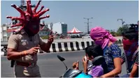 Viral Aksi Polisi Gunakan Helm Virus Corona untuk Edukasi Warga