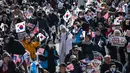 Kantor Investigasi Korupsi (CIO) bersama penyidik Korea Selatan membatalkan rencana penangkapan paksa Presiden Yoon Suk Yeol pada Jumat (3/1/2025) dengan alasan keamanan. (Philip FONG/AFP)