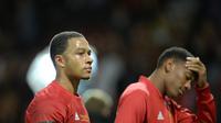 Memphis Depay (kiri) dan striker Anthony Martial (kanan). OLI SCARFF / AFP