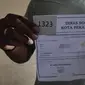 Blangko penerimaan bantuan keuangan warga terdampak Covid-19 yang harus dibawa ke Pekanbaru untuk syarat pencairan. (Liputan6.com/M Syukur)