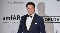Selain diduga sebagai gay, aktor John Travolta juga pernah dituduh melakukan pelecehan seksual terhadap sesama pria. (AFP PHOTO/Alberto PIZZOLI)