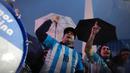 Pasca kegagalan di Copa America, Lionel Messi akhirnya memutuskan pensiun dari timnas Argentina. Keputusan  Messi membuat sejumlah fans berunjuk rasa untuk meminta Messi kembali ke tim Tango. (AFP/Emiliano Lasalvia)