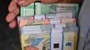 Bank Indonesia juga membuka kuota 5 ribu pendaftar penukaran uang melalui aplikasi PINTAR. (Adek BERRY/AFP)