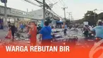Kecelakaan truk dengan muatan 80.000 bir kaleng terbalik di Thailand. Ratusan warga berebutan mengumpulkan minuman kaleng tersebut.