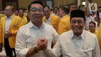 Ridwan Kamil - Suswono melakukan salam komando saat acara deklarasi bakal calon gubernur pada Pilkada DKI Jakarta 2024 di Hotel Sultan, Jakarta, Senin (19/8/2024). (Liputan6.com/Herman Zakharia)