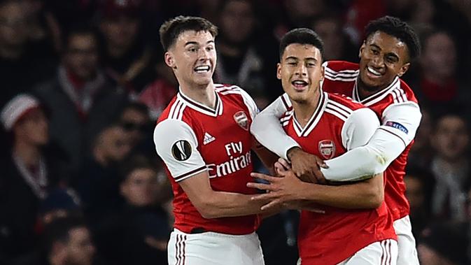 Para pemain Arsenal merayakan gol yang dicetak Gabriel Martinelli ke gawang Standard Liege pada laga Liga Europa di Stadion Emirates, London, Kamis (3/10). Arsenal menang 4-0 atas Liege. (AFP/Glyn Kirk)