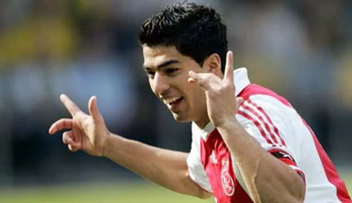 Selebrasi striker Ajax, Luis Suarez setelah mencetak gol ke gawang VVV-Venlo dalam lanjutan Eredivisie di Venlo, 20 September 2009. AFP PHOTO/ANP/MARCEL VAN HOORN 