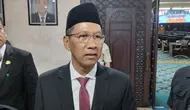 Penjabat (Pj) Gubernur DKI Jakarta Heru Budi Hartono usai menghadiri Penyampaian Jawaban Pendapat Gubernur atas Pandangan Umum Fraksi-Fraksi terhadap Raperda tentang Pertanggungjawaban Pelaksanaan APBD (P2APBD) Tahun Anggaran 2022. (Liputan6.com/Winda Nelfira)