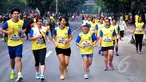 Ribuan peserta mengikuti lomba lari bertajuk 'EU On The Move 5K' di Sudirman, Jakarta, Minggu (3/5/2015). Acara lari tersebut memulai garis start di Sampoerna Strategic Square dan finish di Menara Intiland. (Liputan6.com/Yoppy Renato)
