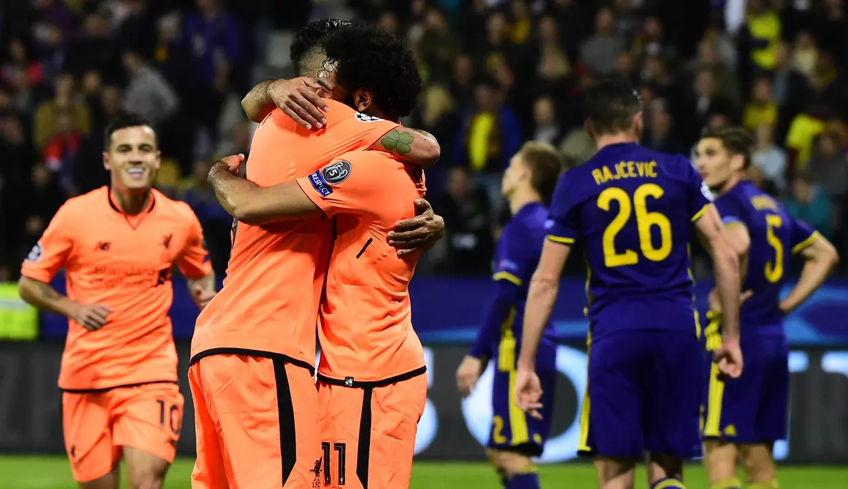 Para pemain Liverpool merayakan kemenangan atas Maribor pada laga Liga Champions di Stadion Ljudski Vrt, Maribor, Selasa (17/10/2017). Maribor kalah 0-7 dari Liverpool. (AFP/Jure Makovec)