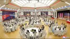 Staf Administrasi Teknologi Dirgantara Nasional (NATA) menghadiri pesta perayaan peluncuran satelit mata-mata di Pyongyang, Korea Utara, 23 November 2023. (Korean Central News Agency/Korea News Service via AP)