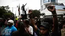 Massa dari Aliansi Mahasiswa Papua dan Front saat berunjuk rasa di jalan Imam Bonjol, Jakarta, Kamis (1/12). Dalam aksinya mereka meminta kemerdekaan di Tanah Papua, terutama di Papua Barat. (Liputan6.com/Faizal Fanani)
