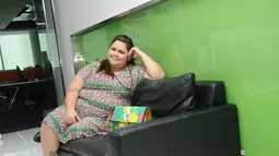Meski memiliki berat badan di atas rata-rata (125 kg), Jelita Clarisa Ramlan, mengaku tidak pernah mempermasalahkan hal tersebut, (16/7/2014). (Liputan6.com/Helmi Fithriansyah)