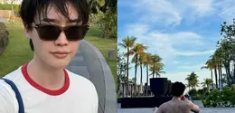 Lee Jong Suk liburan di Canggu, Bali. Mengenakan kaus putih dan celana pendek, ia tampil kasual, berenang pamer tubuh atletis, dan menonjolkan tren quiet luxury (@jongsuk0206)