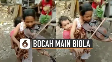 Baru-baru ini beredar video bocah perempuan bermain biola sambil menggendong adiknya. Banyak netizen yang berkomentar supaya ia bisa bertemu dengan Addie MS.