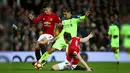 Manchester United dan Liverpool  bermain dengan terbuka dan saling serang di matchday 21 Premier League di Old Trafford, Minggu (15/1). Pertandingan pun berjalan menarik dengan Liverpool unggul lebih dahulu. (AP Photo/Dave Thompson)