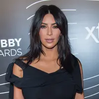 Kim Kardashian lahir dan besar dengan keluarga besar. Kendati demikian, ia mengaku tak ingin miliki anak lebih dari empat. (MARK SAGLIOCCO / GETTY IMAGES NORTH AMERICA / AFP)